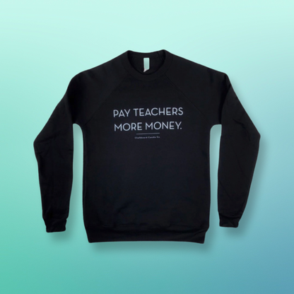 Crew neck black sweatshirt with 'Pay Teachers More Money' on the front in white text.