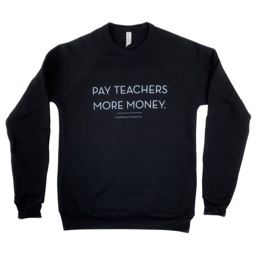 Crew neck black sweatshirt with 'Pay Teachers More Money' on the front in white text on a white background.